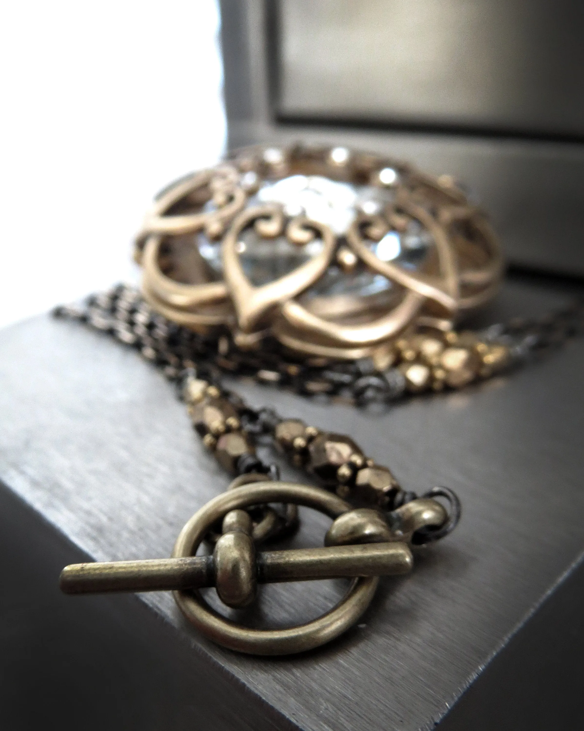 INNER LIGHT - Large Crystal Pendant with Antique Gold Mandala Cage